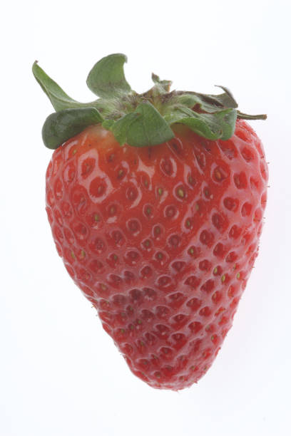 istock Closeup of a strawberry on white background 1464960927