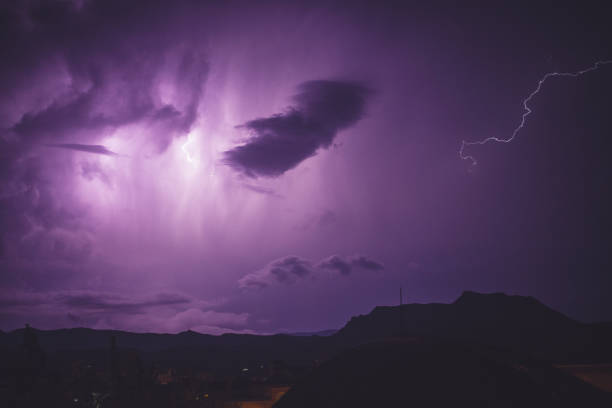 istock Flash of beautiful purple lightning on the sky 1464961052