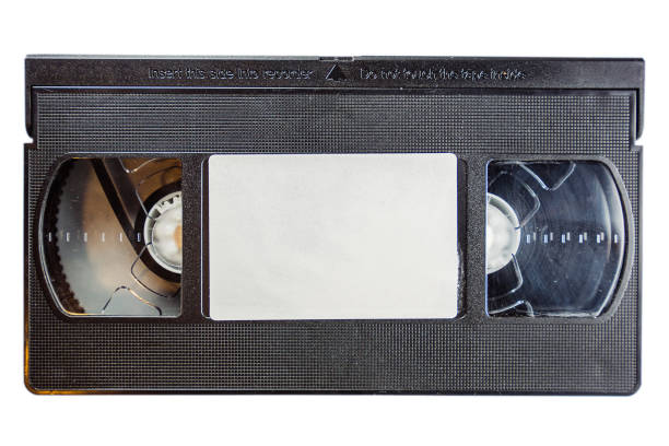 istock Old film cassette isolated on a white background 1464961457