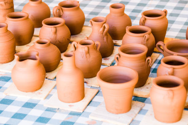 istock Selective focus shot of freshly made clay pots 1464961458