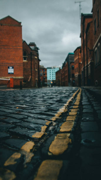 istock Vertical shot of an empty route surrounded by buildings 1464961483