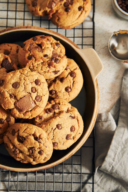 istock Vertical shot of delicious chocolate cookies with grid on a white table 1464961598