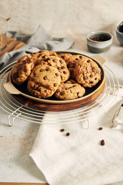 istock Vertical shot of delicious chocolate cookies with grid on a white table 1464961603