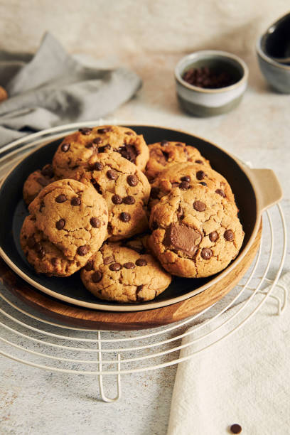 istock Vertical shot of delicious chocolate cookies with grid on a white table 1464961612