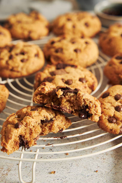 istock Deliciously baked cookies with chocolate chips on a baking grid 1464961624