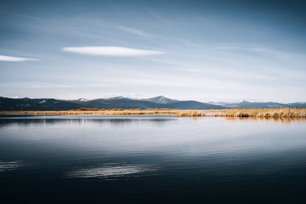 istock Beautiful seascape with mountains under a blue sky 1464967917