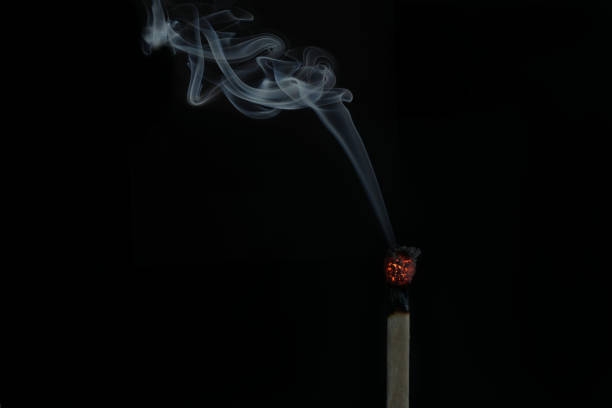 istock Burning match isolated on a black background 1464967976