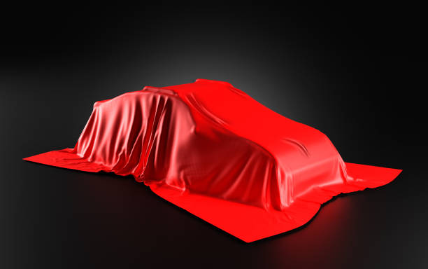 istock Car Covered with a Red Satin Cloth in a Exhibition for Unveiling on black background - 3D Illustration Render 1464968393
