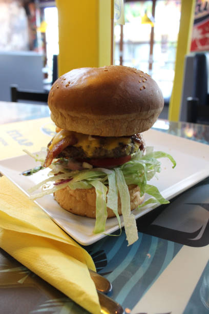 istock Vertical shot of a burger with big buns 1464968435