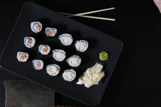 istock Top view of sushi set on a black board 1464969624