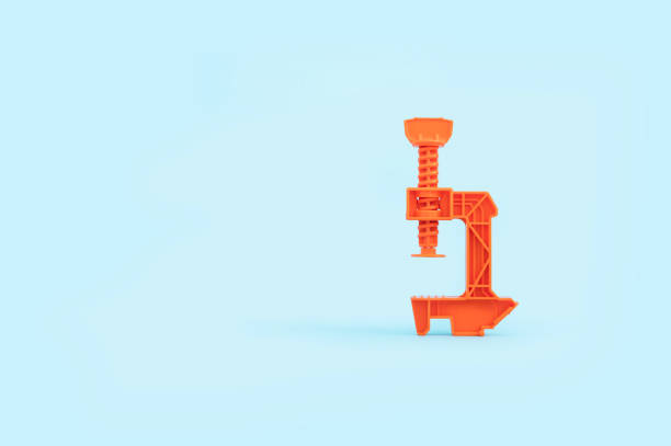 istock Orange toy crane isolated on a blue background 1464969630