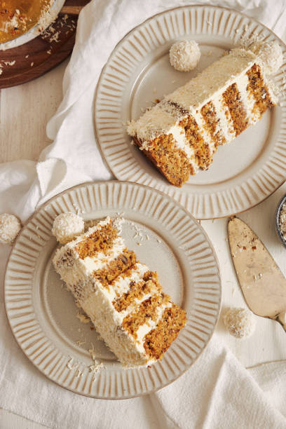 istock Vertical top view of two plates with creamy white Raffaello cake slices on them 1464970144