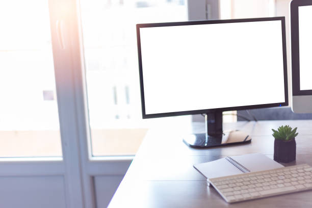 istock Workplace with a computer, keyboard in front of the window 1464970944