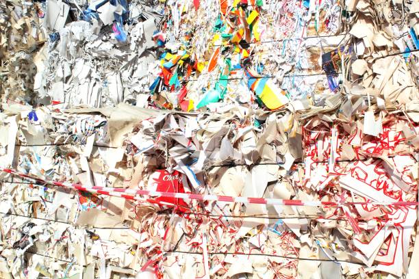 istock Wastepaper compact texture pile for recycling on sorting plant. Technology of reuse materials. Stack of shredded paper 1464972628