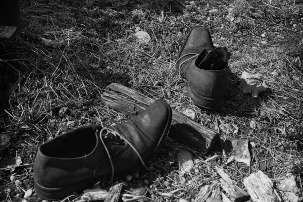 istock Old abandoned worn-out shoes 1464973380