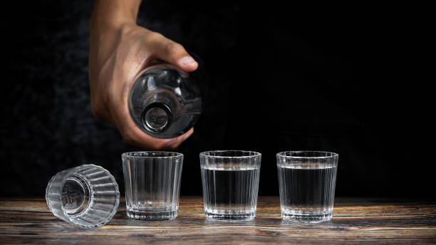 istock Barman pouring tequila into four shots 1464973913