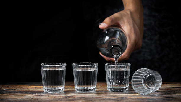 istock Barman pouring tequila into four shots 1464973915