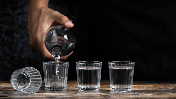 istock Barman pouring tequila into four shots 1464973916