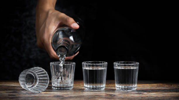 istock Barman pouring tequila into four shots 1464973917