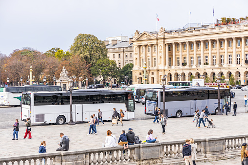 Tour buses parked on the Place de la Concorde square in Paris, France