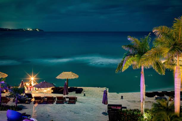 istock Peaceful evening on tropical beach with bright lights, long exposure 1464975599