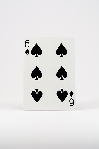 A vertical shot of a playing card isolated on a white background