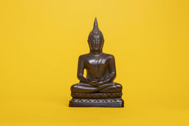istock Religious asian sculpture in typical meditation stance 1464977057