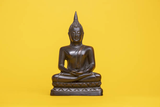 istock Religious asian sculpture in typical meditation stance 1464977058