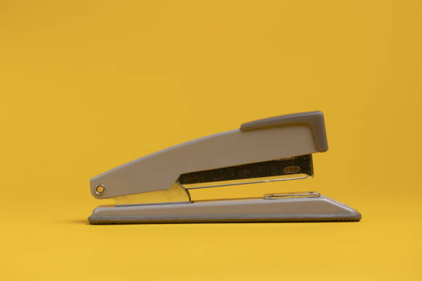 The stapler starts to rust on a white background