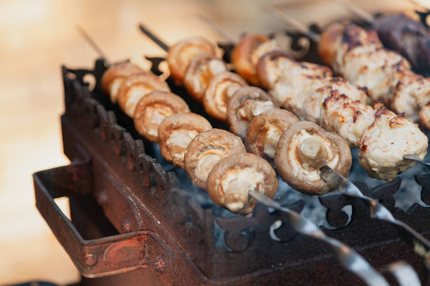 istock Appetizing mushrooms are fried on the grill 1464977393