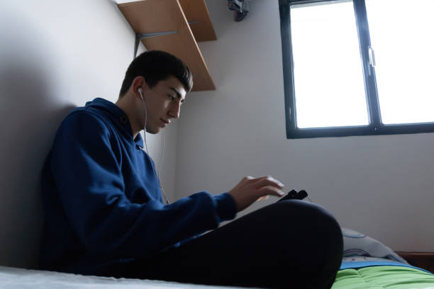 istock Teenager in his Room 1464978774