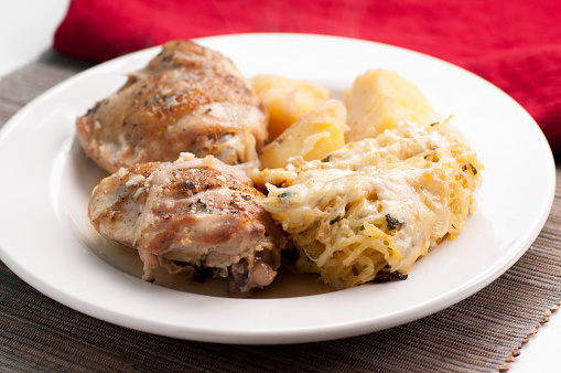 chicken thighs with baked squash gratin and potatoes