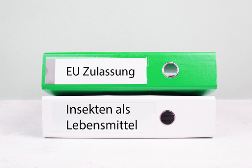 EU authorization, insects in food is standing in german language on the file folder, permission for ingredients