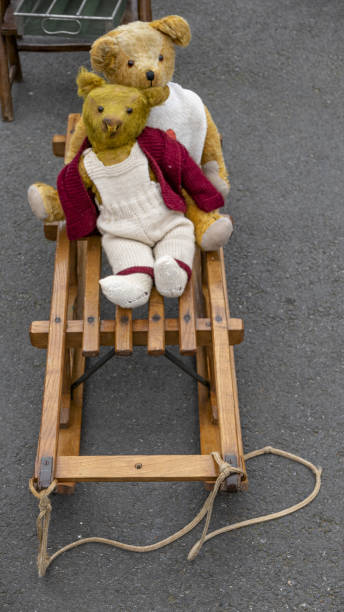 istock Two vintage teddy bears on a wooden sledge 1464981376