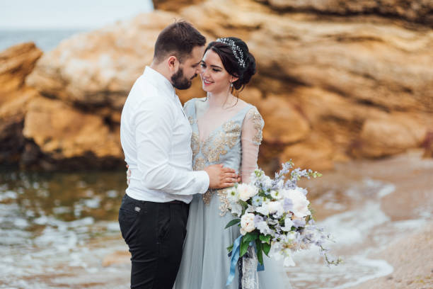 istock same couple with a bride in a blue dress walk 1464982443
