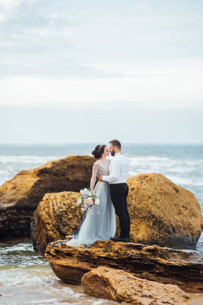 istock same couple with a bride in a blue dress walk 1464982523