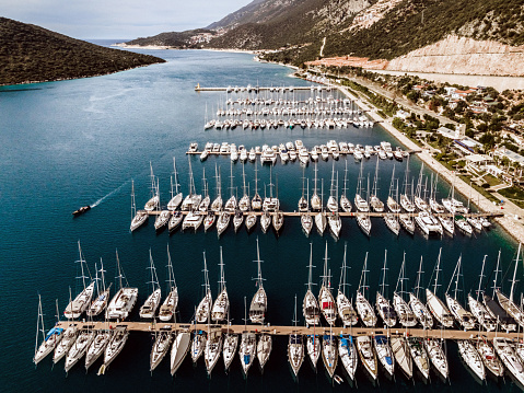 Aerial drone view of marina bay, sea and mountains on background. Kaş, Türkiye