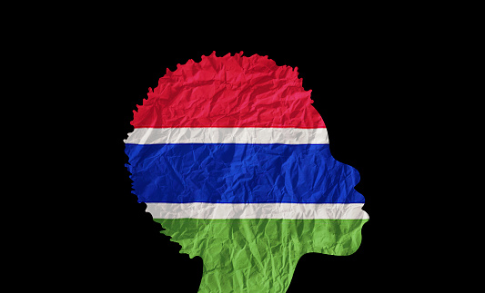 African woman silhouette with Gambia national flag.