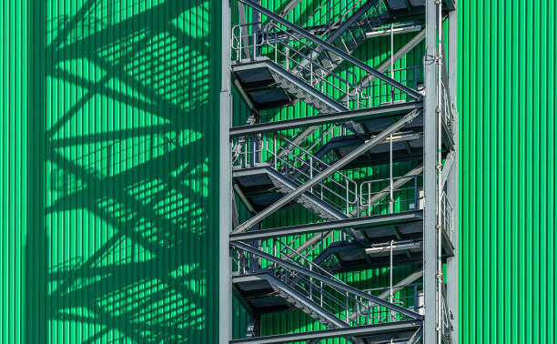 istock Low angle view of staircase against green wall 1465000520