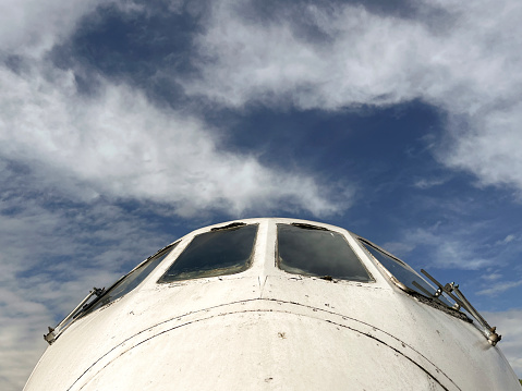 Old aeroplane cockpit view with blue sky