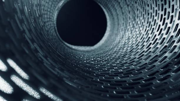 istock Inside view on metal silver pipe with holes - close up 1465006885