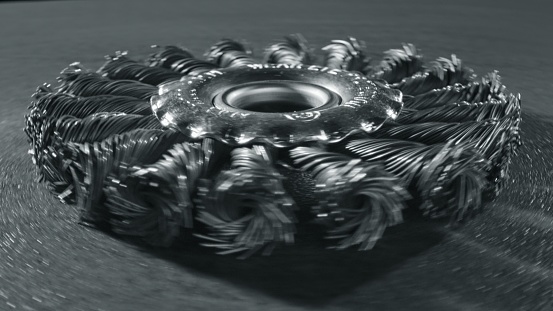 Spinning shiny metal disc brush