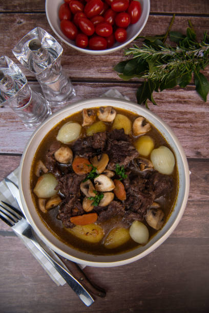 istock Beef bourguignon recipe, beef stew with wine sauce and vegetables 1465011737