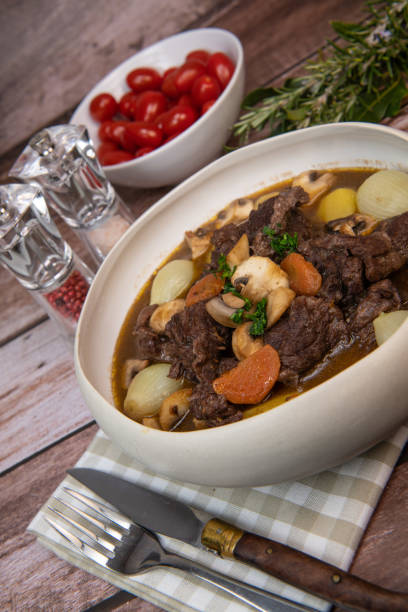 istock Beef bourguignon recipe, beef stew with wine sauce and vegetables 1465012258