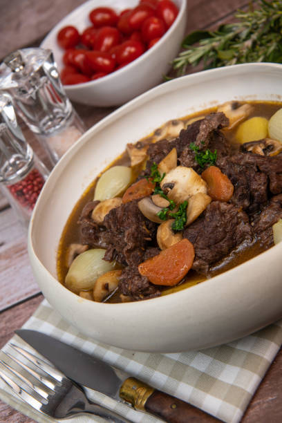 istock Beef bourguignon recipe, beef stew with wine sauce and vegetables 1465012270