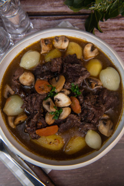 istock Beef bourguignon recipe, beef stew with wine sauce and vegetables 1465012282