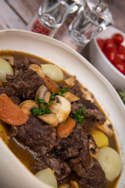 istock Beef bourguignon recipe, beef stew with wine sauce and vegetables 1465012790