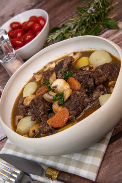 istock Beef bourguignon recipe, beef stew with wine sauce and vegetables 1465012793