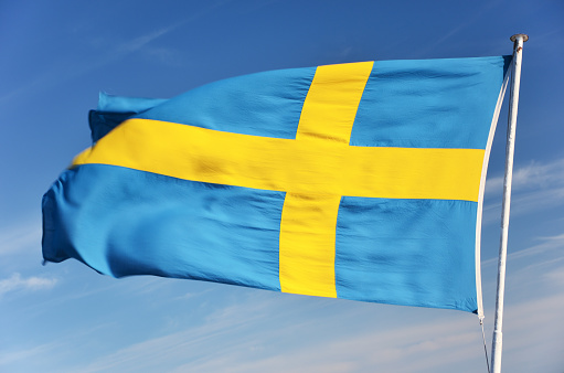 Sweden's flag blowing in the wind photo