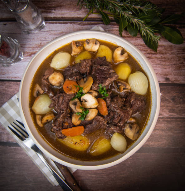 istock Beef bourguignon recipe, beef stew with wine sauce and vegetables 1465013382